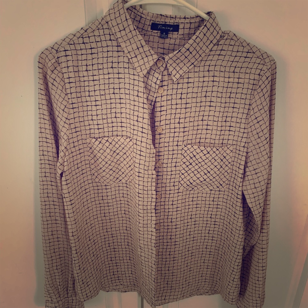 Long sleeve button down top.